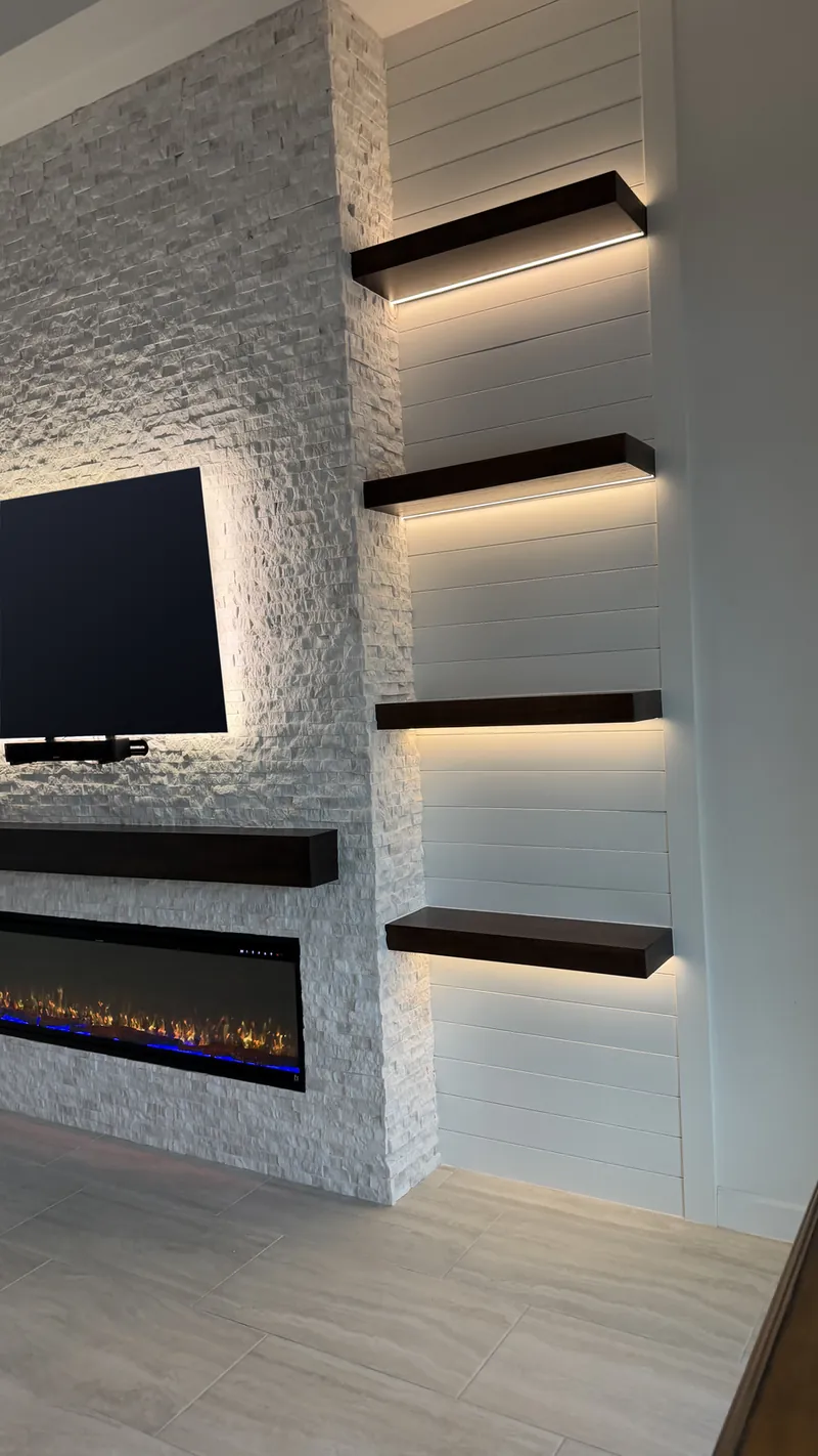From the left: the stone column and the lit espresso shelves on the shiplap