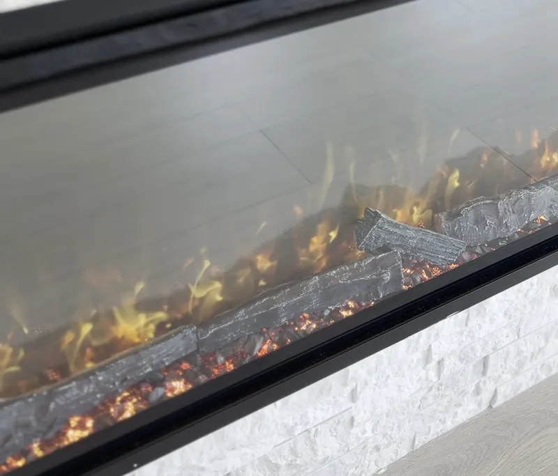 Close view of the flame and embers in the linear fireplace