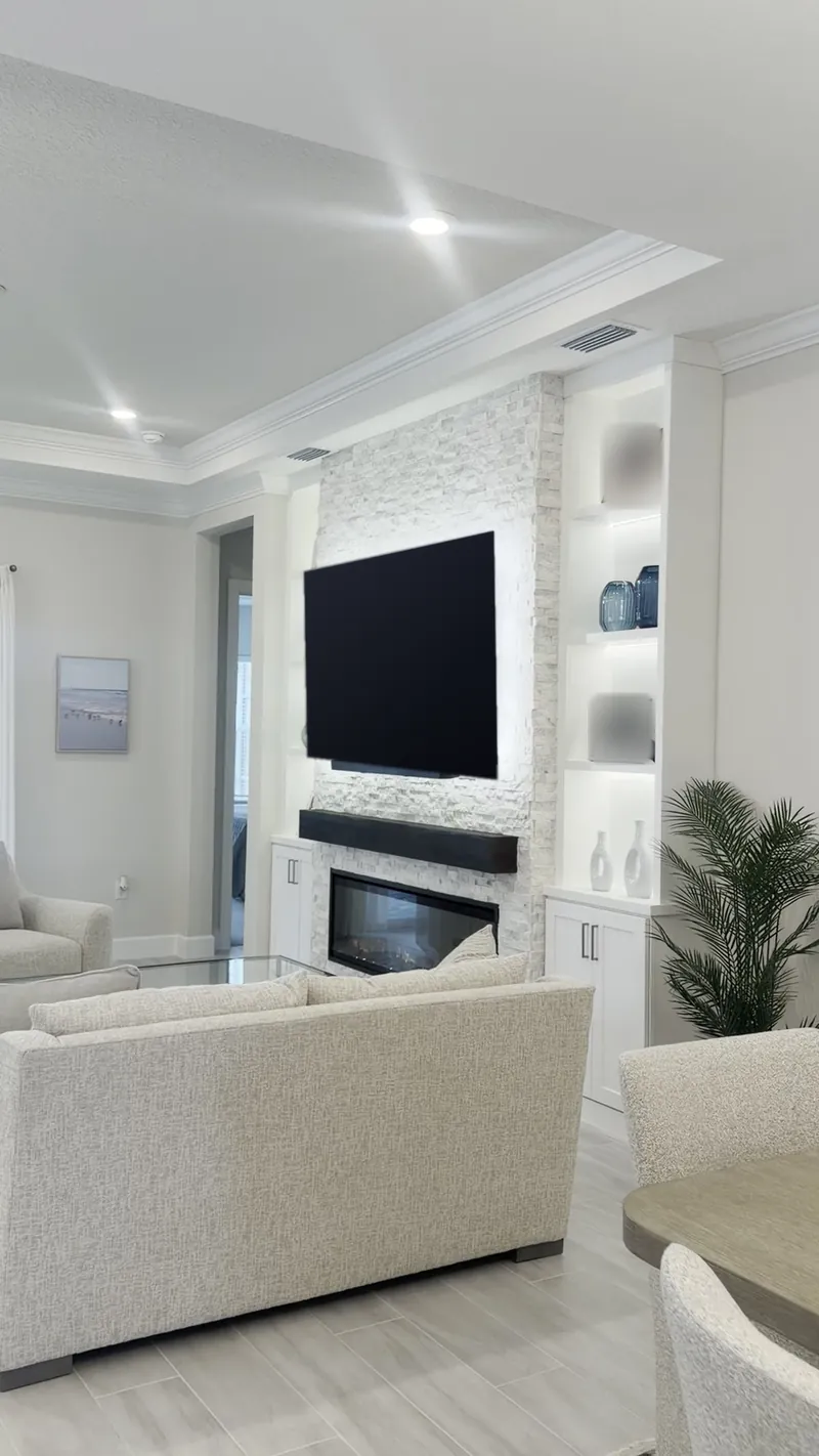 The fireplace wall seen from across the living room