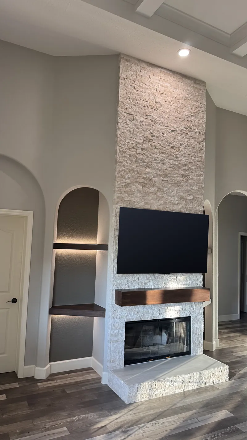 Angled view with one lit arch and the raised hearth