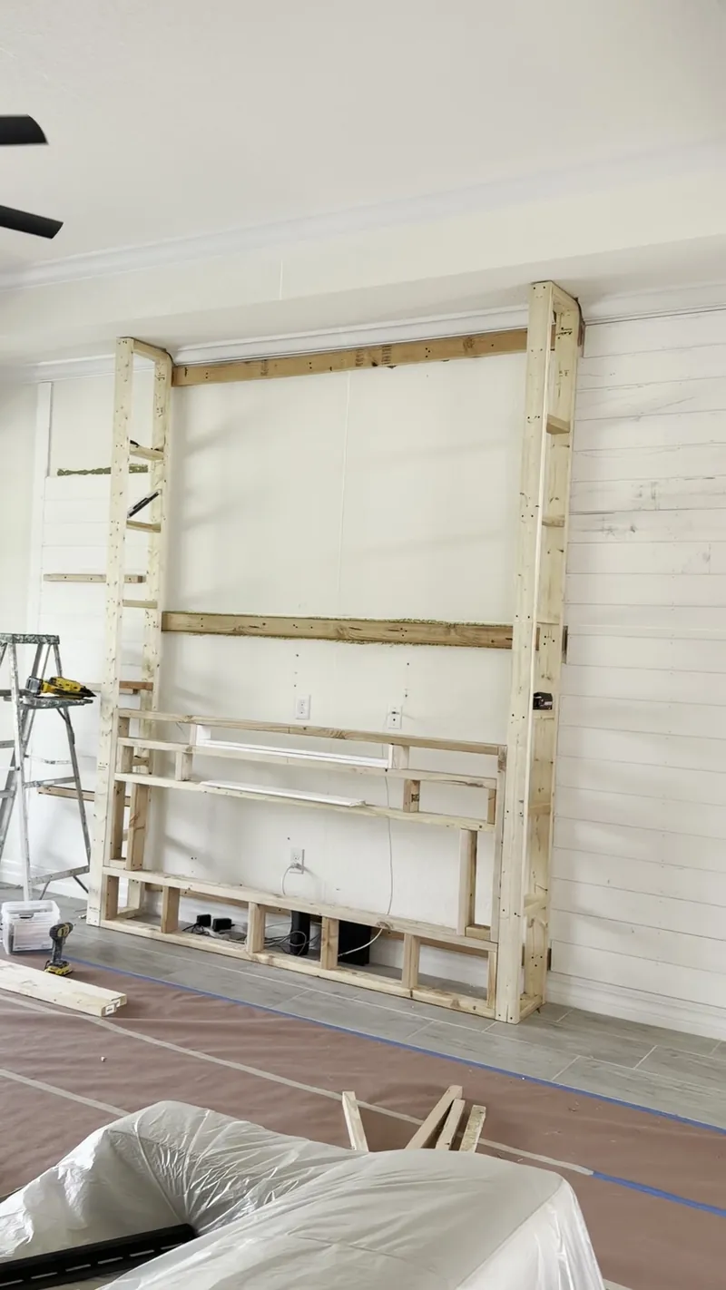 A new wood frame standing in front of the old wall