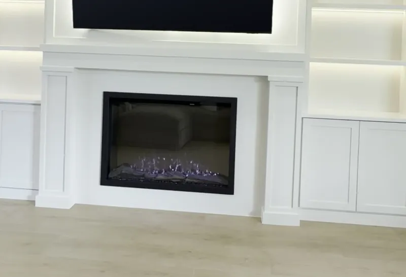 A fireplace in a classic white surround