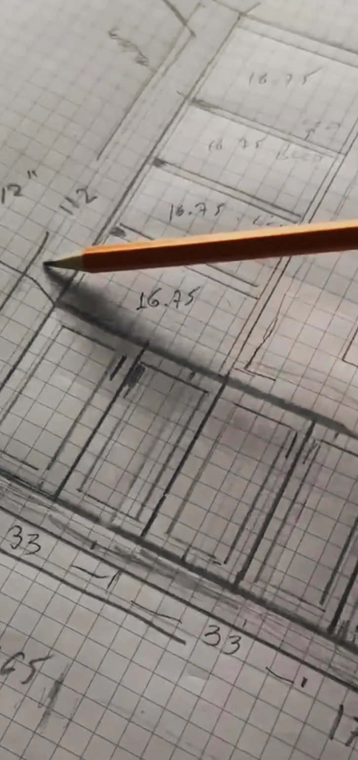 A pencil sketch of the wall on graph paper with measurements
